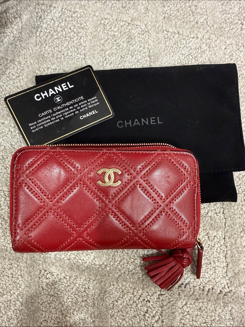 CHANEL Quilted Tassel Zip Wallet in Red with Gold CC